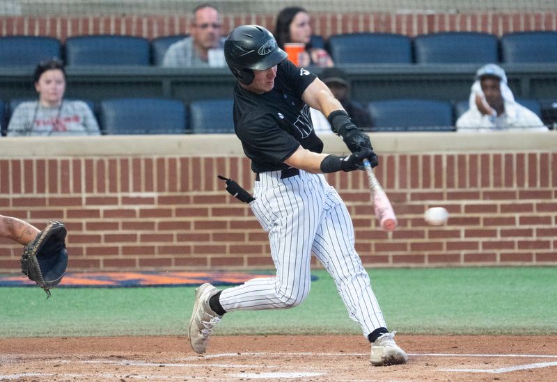 Milwaukee Panthers' Dylan O'Connell (2) hits the ball as Milwaukee Panthers take on UCF Knights during the NCAA Regional Baseball tournament at Plainsman Park in Auburn, Ala. on Saturday, May 30, 2026.