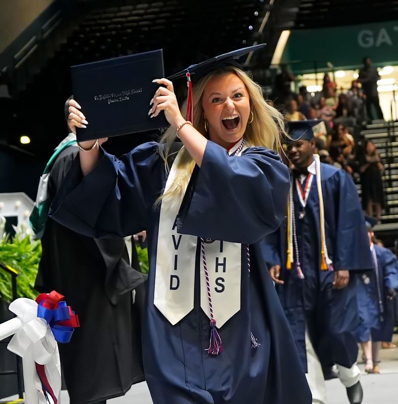 A Taylor Middle-High School Class of 2026 grad celebrates during commencement exercises, May 30, 2026, at the Ocean Center in Daytona Beach.