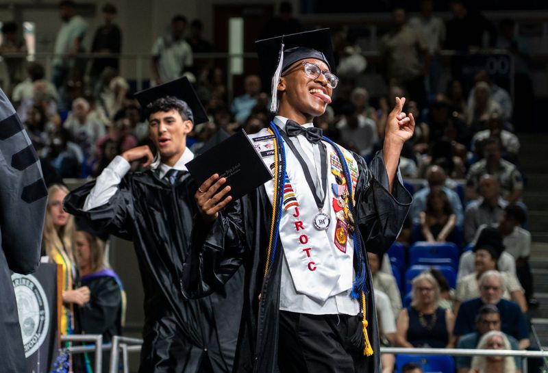 Tristan Hyman celebrates after receiving his diploma during the commencement ceremony for the Mariner High School Class of 2026 at Alico Arena in Fort Myers, Fla., on Sunday, May 31, 2026.