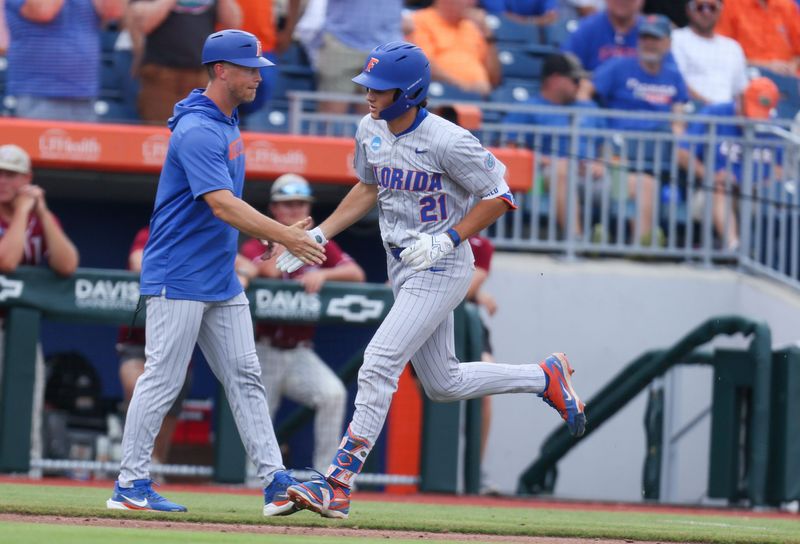 Florida utility Caden McDonald (21) celebrates a home run during the 2026 NCAA Baseball Championship Gainesville Regional championship baseball game at Condron Family Ballpark in Gainesville, FL on Sunday, May 31, 2026. [Alan Youngblood/Gainesville Sun]
