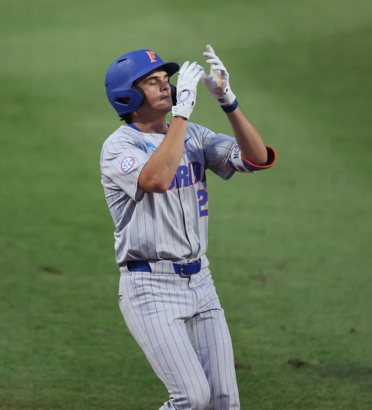 Florida utility Caden McDonald (21) celebrates a home run during the 2026 NCAA Baseball Championship Gainesville Regional championship baseball game at Condron Family Ballpark in Gainesville, FL on Sunday, May 31, 2026. [Alan Youngblood/Gainesville Sun]