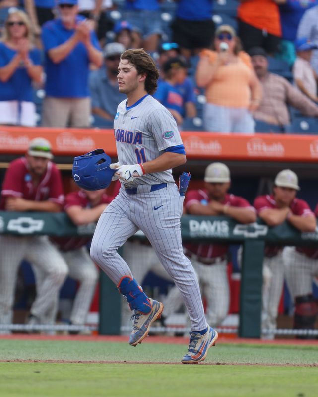 Florida infielder Brendan Lawson (11) celebrates a home run during the 2026 NCAA Baseball Championship Gainesville Regional championship baseball game at Condron Family Ballpark in Gainesville, FL on Sunday, May 31, 2026. [Alan Youngblood/Gainesville Sun]