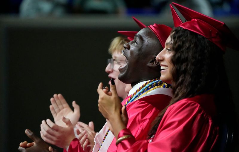 North Fort Myers senior Sebastian Jean-Pierre reacts during one of the graduation speeches. Approximately 475 seniors graduated from North Fort Myers High School, Sunday, May 31, 2026. The ceremony, held at Alico Arena, was an emotional event for faculty, graduates, and family members.
