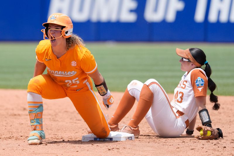 Tennessee Lady Volunteers infielder Ella Dodge (25) celebrates beside Texas Longhorns utility Leighann Goode (43) at second base in the third inning of a Women's College World Series softball game between the Tennessee Volunteers and the Texas Longhorns at Devon Park in Oklahoma City, Thursday, May 28, 2026. Tennessee won 6-3.