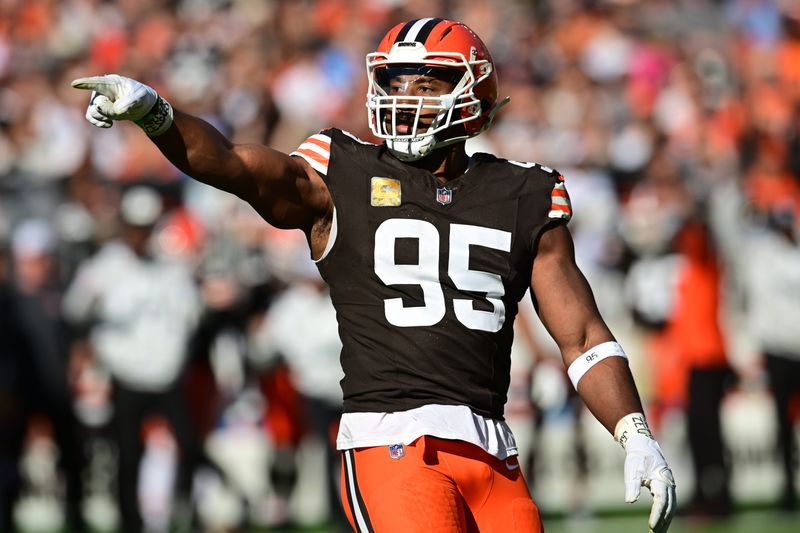 Nov 3, 2024; Cleveland, Ohio, USA; Cleveland Browns defensive end Myles Garrett (95) celebrates after a play during the first quarter against the Los Angeles Chargers at Huntington Bank Field.