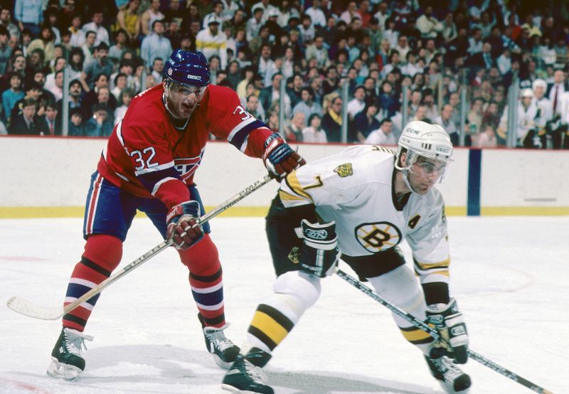Apr 11, 1987; Boston, MA, USA; FILE PHOTO; Boston Bruins defenseman Ray Bourque (7) battles Montreal Canadiens right wing Claude Lemieux (32) during the 1987 NHL Division Semi_Finals at the Boston Garden. The Canadiens defeated the Bruins 4 games to 0. Mandatory Credit: Dick Raphael-USA TODAY Sports
