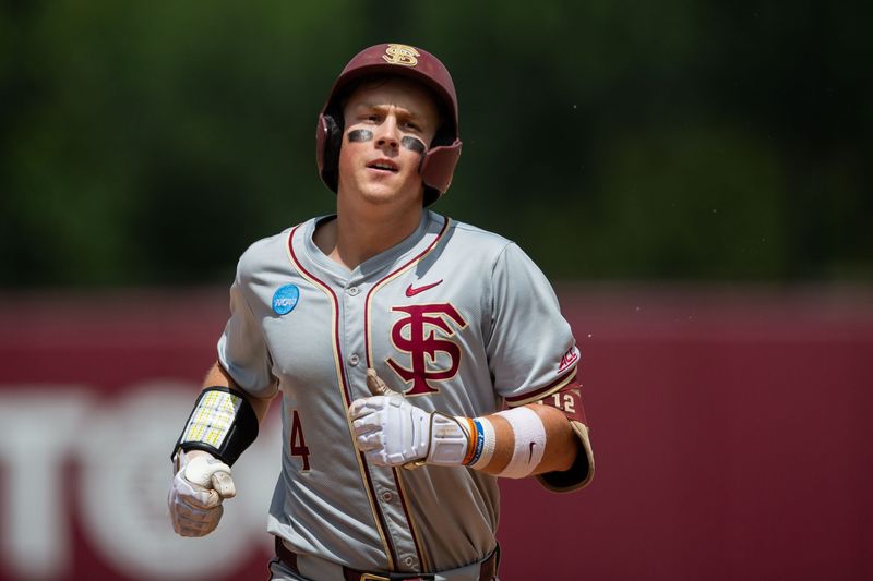 Florida State Seminoles infielder Cal Fisher (4) rounds third after hitting his second home run. The St. John's Red Storm defeated the Florida State Seminoles 5-4 in the Tallahassee Regional finals at Dick Howser Stadium on Monday, June 1, 2026.