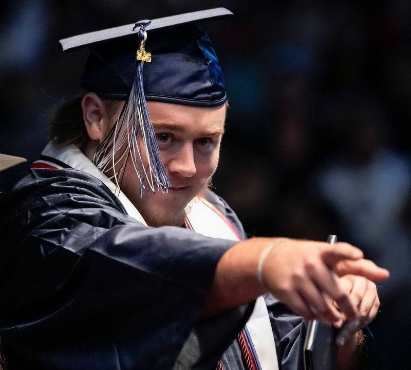 Sebastian Hayes points to the camera after receiving his diploma during the commencement ceremony for the Estero High School Class of 2026 at Suncoast Credit Union Arena in Fort Myers, Fla., on Monday, June 1, 2026.
