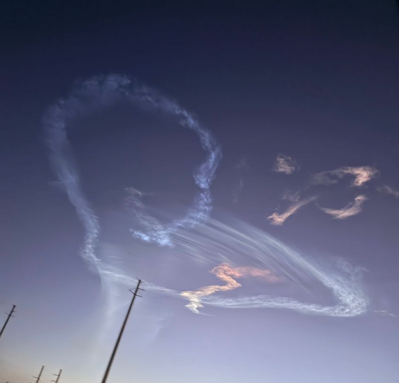 Florida photographers captured a visual "space jellyfish" spectacle minutes after SpaceX rocket launch: the colorfully illuminated plume of the Falcon 9 rocket's exhaust expanding across the predawn sky. The Falcon 9 lifted off at 5:52 a.m. March 4, 2026, from Cape Canaveral Space Force Station on the memorable Starlink 10-40 mission. View of a heart contrail minutes after launch and the “space jellyfish” effect from Port St. John.