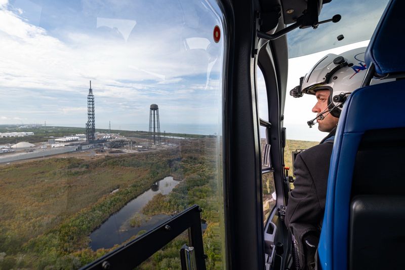 NASA Administrator Jared Isaacman flies in a helicopter above Launch Complex 36, Blue Origin's site at the Cape Canaveral Space Force Station where the company launches it New Glenn rocket. The towering rocket exploded May 28 while being tested on the launch pad.