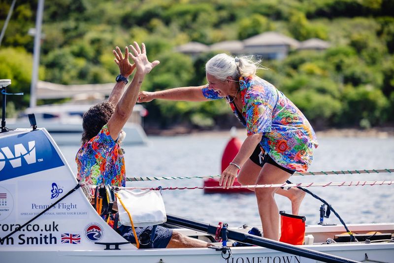 Ocean rowers Paul Lore of Fernandina Beach, left, and Dawn Smith cheer as they complete the 3,000-mile World's Toughest Row from La Gomera in the Canary lslands to Antigua.
