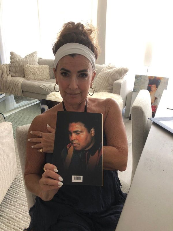 Alicia Shulman holds the Muhammad Ali biography with her photo on the back cover. Marc Berman/Special to The Post