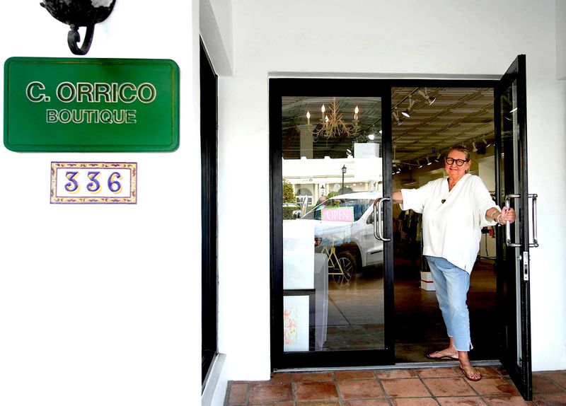 Co-owner Casey Orrico stands in the doorway of C. Orrico at 336 S. County Road in Palm Beach on May 29. The store closed temporarily after May 30 as the boutique undergoes a major renovation.