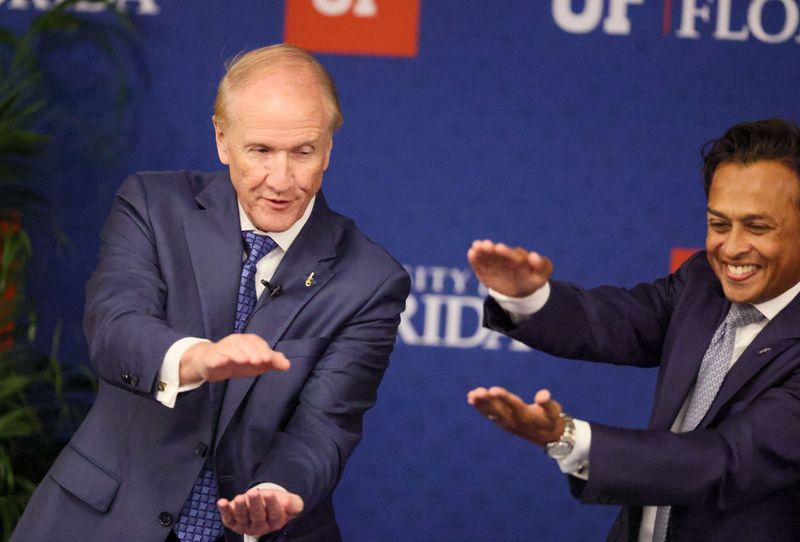 Stuart Bell, the sole finalist for the University of Florida’s 14th presidency, left, does the Gator chomp with Rahul Patel, vice chair of the University of Florida Board of Trustees, as he meets with students, faculty and staff to answer submitted questions at Emerson Alumni Hall in Gainesville, FL, on Wednesday, June 3, 2026.