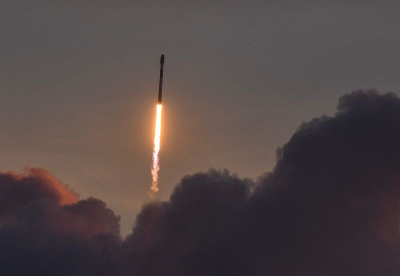 A SpaceX Falcon 9 rocket carrying 29 Starlink broadband satellites cuts through the clouds at 6:26 a.m. June 4.