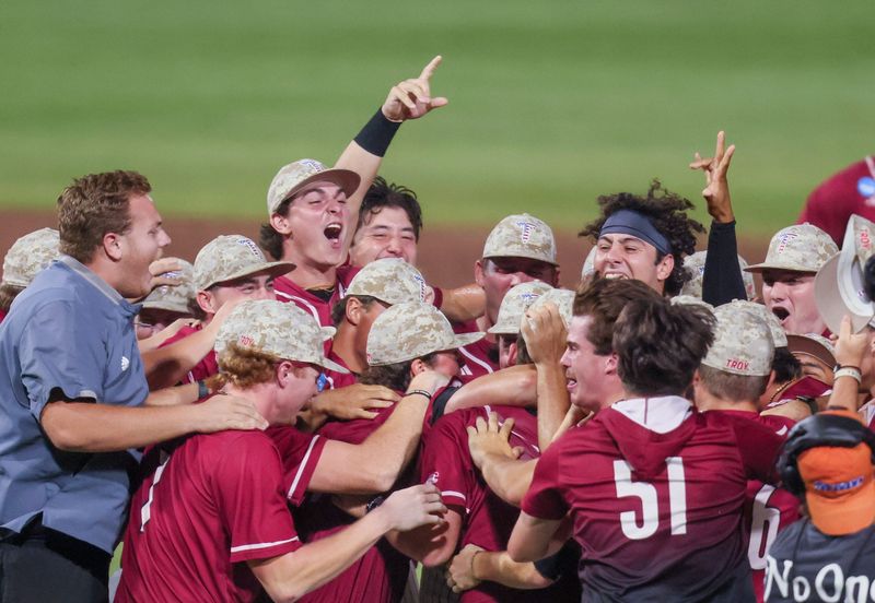 Troy celebrates their 10-2 win over Florida during the 2026 NCAA Baseball Championship Gainesville Regional championship baseball game at Condron Family Ballpark in Gainesville, FL on Monday, June 1, 2026. Troy beat Florida Sunday they played a winner take all game Monday. [Alan Youngblood/Gainesville Sun]