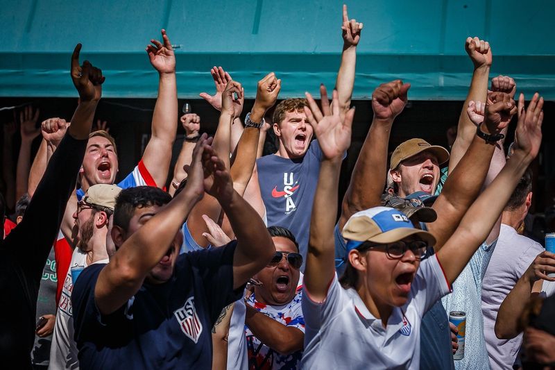 United States Men's National Team supporters watch the FIFA World Cup 2022 match against the Netherlands outside of O'Shea's Irish Pub in downtown West Palm Beach, Fla., on December 3, 2022. The US lost to the Netherlands 3-1.