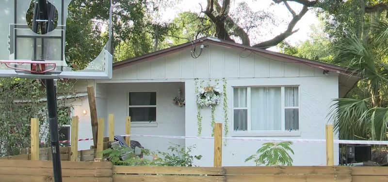 Jacksonville sheriff's officers found human remains buried in carpet-like material in the backyard of this home on Lincrest Drive on June 4.