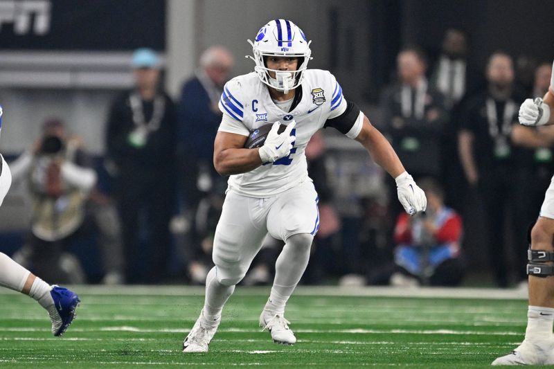 Dec 6, 2025; Arlington, TX, USA; BYU Cougars running back LJ Martin (4) runs with the ball during the first half against the Texas Tech Red Raiders at AT&T Stadium. Mandatory Credit: Jerome Miron-Imagn Images