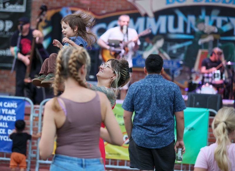 Music lovers enjoy American Dream Survivors perform during Gainesville’s "Free Fridays" concert series at Bo Diddley Plaza on Friday, June 5, 2026. The weekly series runs through Sept. 26, featuring free performances by local and regional bands.