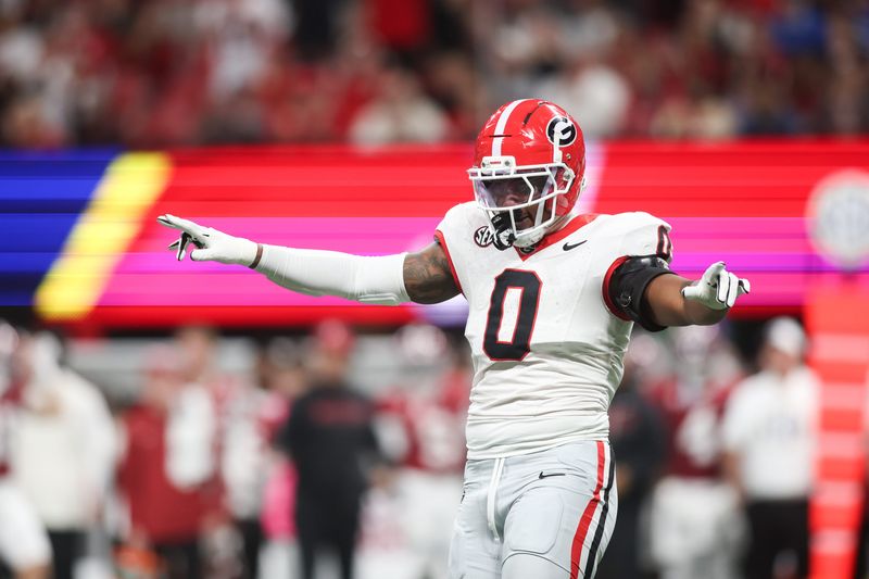 Dec 6, 2025; Atlanta, GA, USA; Georgia Bulldogs linebacker Gabe Harris Jr. (0) celebrates a sack during the first quarter against the Alabama Crimson Tide during the 2025 SEC Championship game at Mercedes-Benz Stadium. Mandatory Credit: Brett Davis-Imagn Images