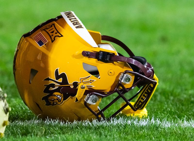 Nov 28, 2025; Tempe, Arizona, USA; Detailed view of an Arizona State Sun Devils helmet on the field during the 99th Territorial Cup at Mountain America Stadium. Mandatory Credit: Mark J. Rebilas-Imagn Images