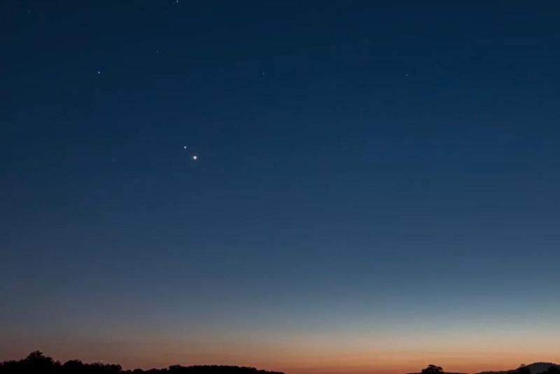 Venus and Jupiter are photographed together in the night sky during a previous conjunction involving the two planets.