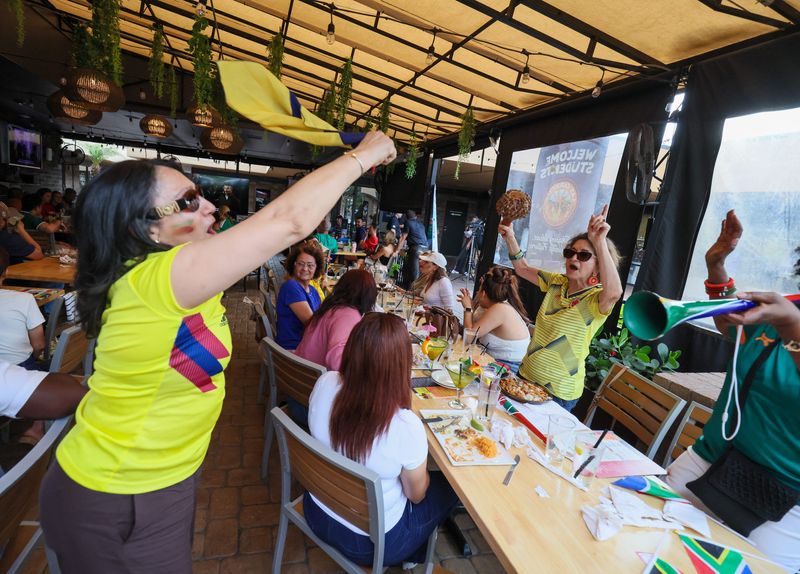 Columbia fan Claudia Upequi cheers on Mexico during Telemundo Gainesville World Cup Watch Party event for the opening game between Mexico and South Africa of the World Cup at Las Carretas Mexican Restaurant in Gainesville, FL on Thursday, June 11, 2026. Telemundo Gainesville and TV20 hosted the community event [Alan Youngblood/Gainesville Sun]