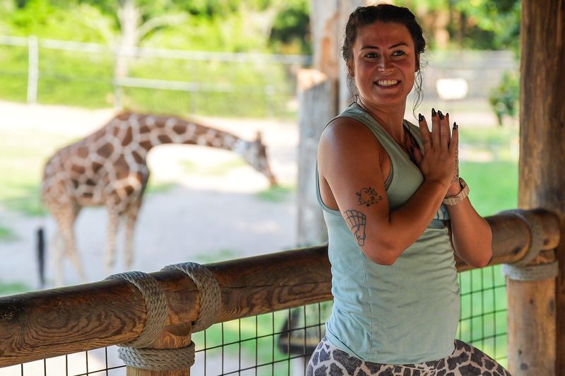 Yoga instructor Rhianna Upthegrove lead Yoga with Giraffes at the Jacksonville Zoo and Botanical Gardens Saturday June 13, 2026. The zoo is hosting the yoga class every Saturday in June from 8 a.m. to 9 a.m. for the zoo’s tallest residents. The event is free to members and $40 for non-members. June 21st is World Giraffe Day and that’s the reason why the zoo decided to offer the classes in June for the third year in a row. [Doug Engle/Florida Times-Union]