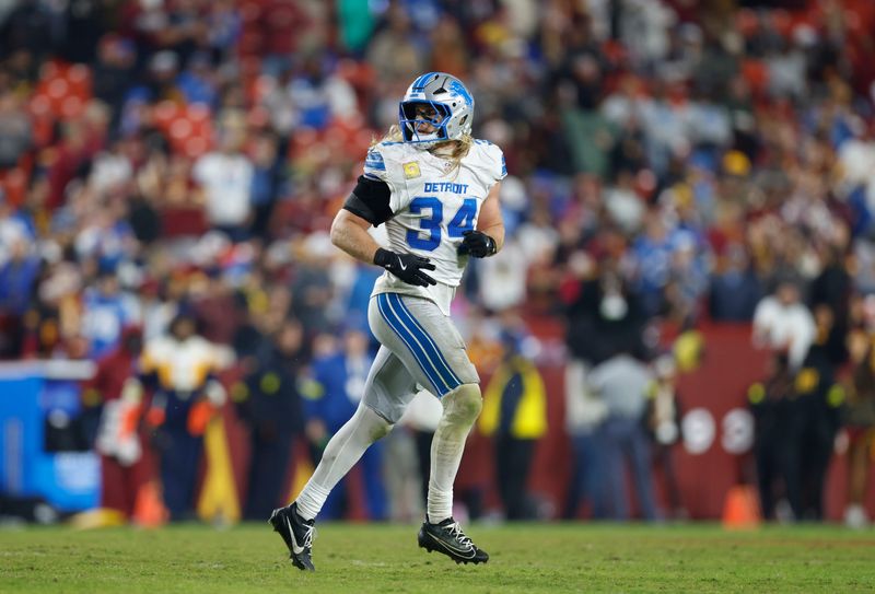 Nov 9, 2025; Landover, Maryland, USA; Detroit Lions linebacker Alex Anzalone (34) runs off the field during the fourth quarter against the Detroit Lions at Northwest Stadium. Mandatory Credit: Peter Casey-Imagn Images