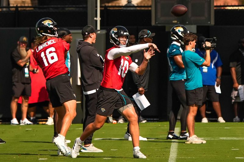 Jaguars quarterback Carter Bradley (10) passes as the Jaguars held their final Organized Team Activity on Monday, June 15, 2026 at the Miller Electric Center in Jacksonville, Fla. [Doug Engle/Florida Times-Union]