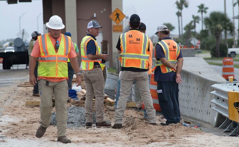 Contractors erect the gantry system for the new  toll plaza complex at the foot of the Bob Sikes Bridge to Santa Rosa Island on June 18, 2026.