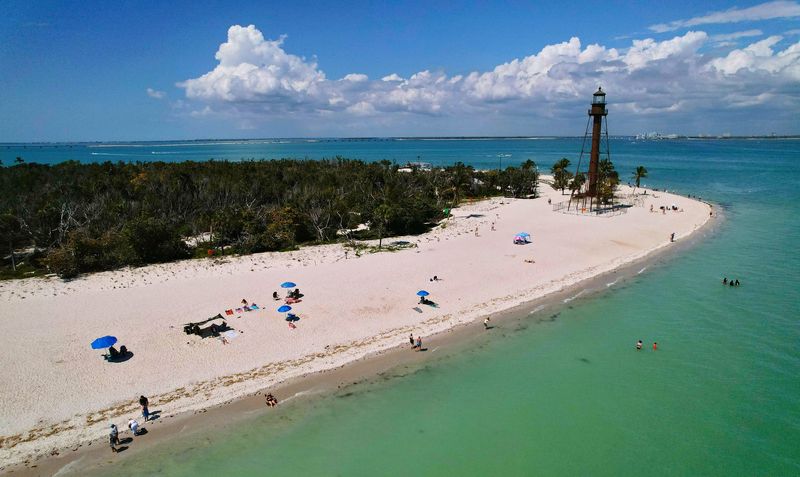 Visitors to Southwest Florida took advantage of the beautiful weather Friday, March 13, 2026, as they flocked to Lighthouse Beach on Sanibel Island, Florida.