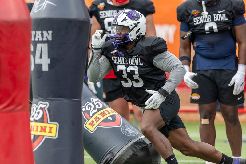 Jan 30, 2025; Mobile, AL, USA; National team defensive lineman David Walker of Central Arkansas (33) works through drills during Senior Bowl practice for the National team at Hancock Whitney Stadium. Mandatory Credit: Vasha Hunt-Imagn Images