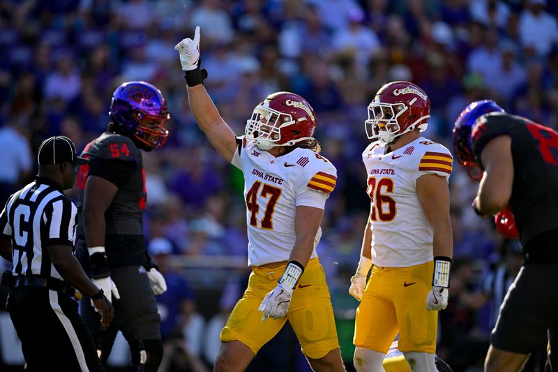 Nov 8, 2025; Fort Worth, Texas, USA; Iowa State Cyclones linebacker Kooper Ebel (47) and linebacker Caleb Bacon (26) celebrates a defensive stop against the TCU Horned Frogs during the first half at Amon G. Carter Stadium. Mandatory Credit: Jerome Miron-Imagn Images