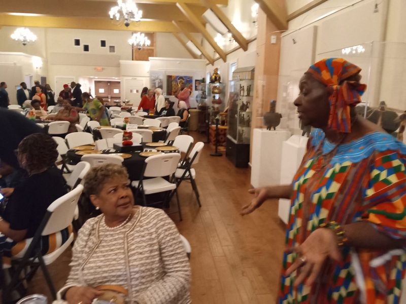 Gainesville City Commissioner Cynthia Chestnut, seated, and Evelyn Foxx, president of the Alachua County NAACP, talk before the annual Juneteenth Breakfast at the Cotton Club Museum and Cultural Center on June 19.