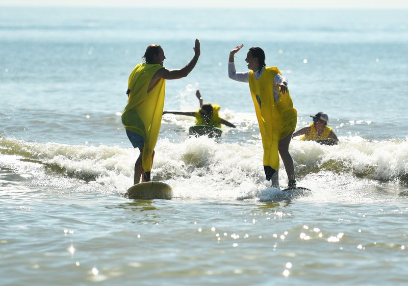 Sun Bum, a local sunscreen company, held a Smells Like Summer Tour event Sunday, June 21 at Minutemen Causeway in Cocoa Beach.trying to set a world record for the most people surfing in banana suits.