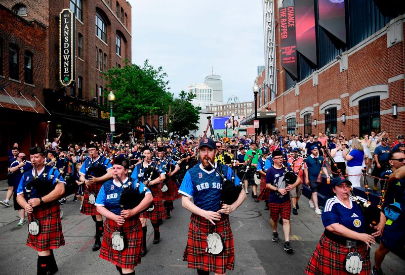 Scotland's Tartan Army march to Boston's Fenway Park baseball stadium - Boston, Massachusetts, U.S. - June 14, 2026 Scotland fans wearing kilts and playing the bagpipes during the march to Fenway Park
