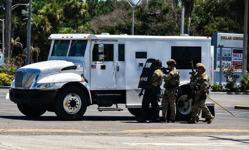 Police in tactical gear approach the kava bar at 625 N. Atlantic Ave. in the Dollar General shopping center in Cocoa Beach. One person was taken into custoday.