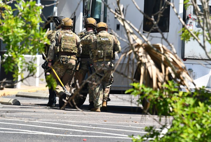 Police in tactical gear approach the kava bar at 625 N. Atlantic Ave., in the Dollar General shopping center in Cocoa Beach. One man was taken into custody in the incident.