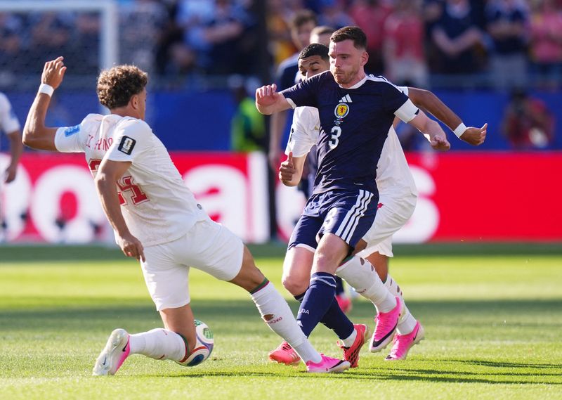 June 19, 2026; Foxborough, Massachusetts, U.S.; Scotland's Andy Robertson in action with Morocco's Neil El Aynaoui.  Mandatory Credit: David Butler Ii-Imagn Images