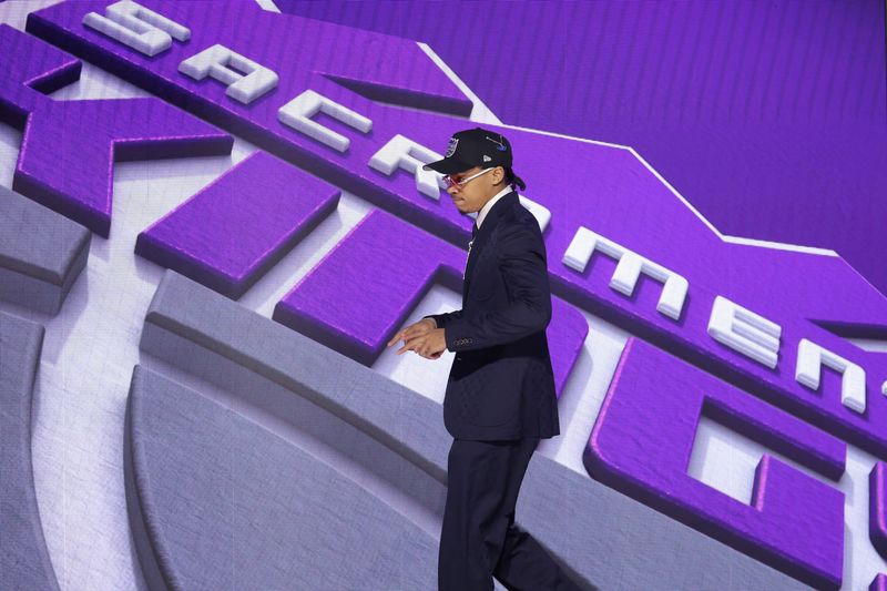 Jun 23, 2026; New York, NY, USA; The seventh pick in the 2026 NBA draft, Arkansas guard Darius Acuff Jr. after he was selected by the Sacramento Kings at Barclays Center. Mandatory Credit: Brad Penner-Imagn Images