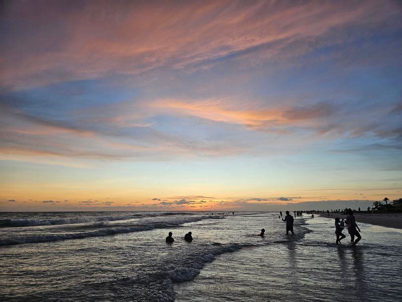 Sunset colors fill the sky above Siesta Beach on Siesta Key in Sarasota County on June 20, 2026.