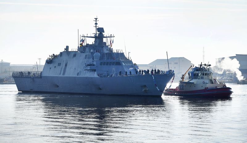 The USS Indianapolis is escorted by a tug as it heads to the pier at Naval Station Mayport on Nov. 26, 2019. The littoral combat ship is designed for near-shore environments to contend with mines, submarines and fast surface craft.