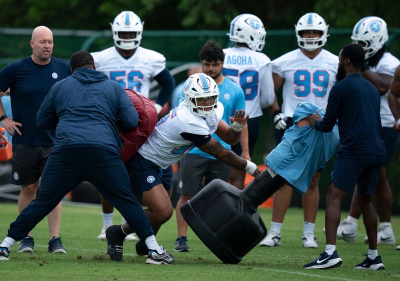 Tennessee Titans defensive end Keldric Faulk (15) goes through drills during OTAs at Vanderbilt Health Football Center in Nashville, Tenn., Monday, June 8, 2026.