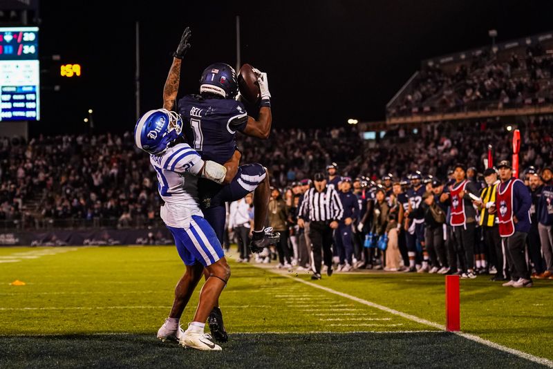 Nov 8, 2025; East Hartford, Connecticut, USA; UConn Huskies wide receiver Skyler Bell (1) makes the touchdown against Duke Blue Devils cornerback Landan Callahan (21) in the second half at Pratt & Whitney Stadium at Rentschler Field. Mandatory Credit: David Butler II-Imagn Images
