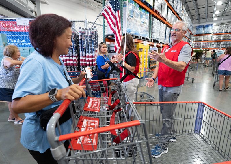 People enter Costco as it opens in Pensacola on June 25, 2026.