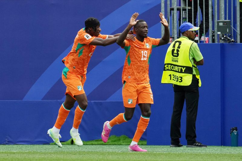 Ivory Coast's Nicolas Pepe (19) celebrates scoring their first goal with Yan Diomande (11) June 25 at Philadelphia Stadium.