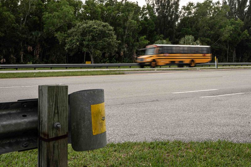A bus passes the proposed Calvary Chapel Christian School parcel on the south side Indiantown Road in unincorporated Palm Beach County, Fla., on June 25, 2026.