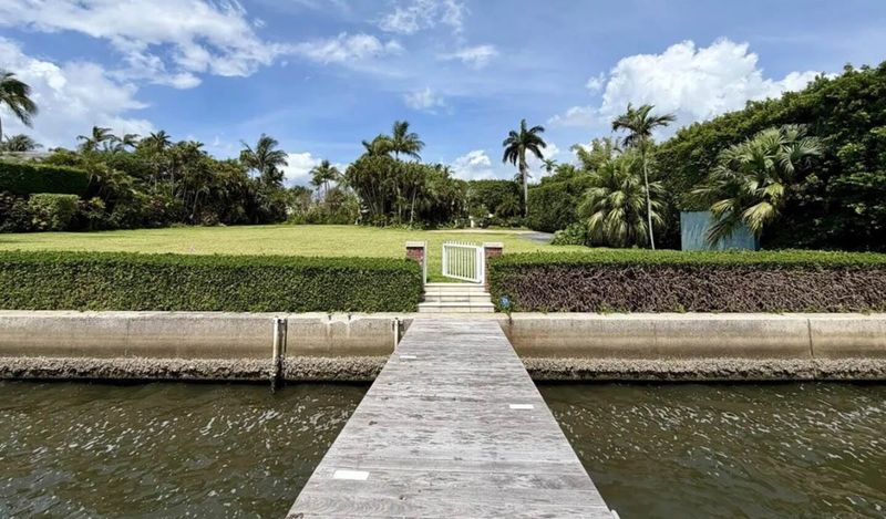 A private dock in the Intracoastal Waterway leads to 690 Island Drive, a vacant lot that has changed hands for a recorded $39.2 million in Palm Beach.